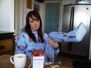 Jill in her footie pajamas at breakfast this morning. I'm very jealous......